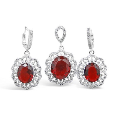 STERLING SILVER SET OVAL RUBY GLASS RADIATING CUBIC ZIRCONIA LINES